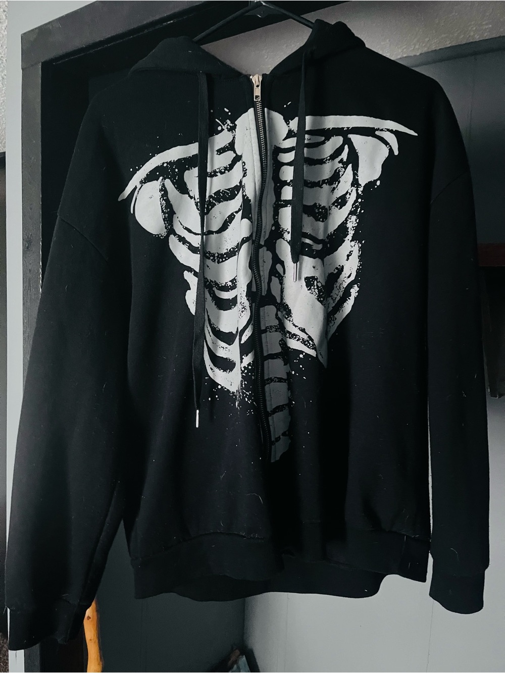 Black Zip-Up Hoodie with White Ribcage Graphic